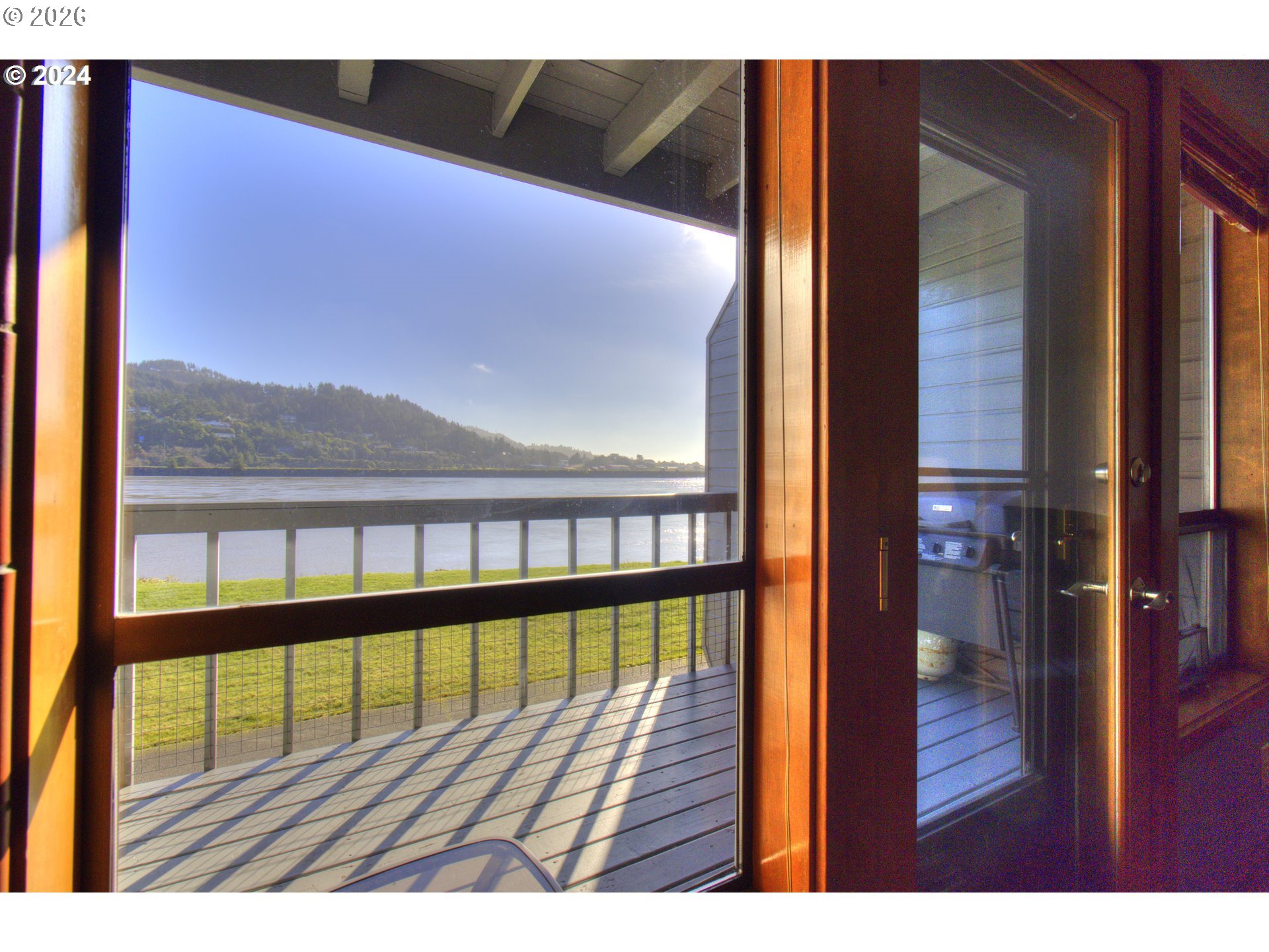 94304 Wedderburn Loop, Unit 419 Gold Beach, OR 97444 - Photo 14 of 23 a view of balcony with wooden floor