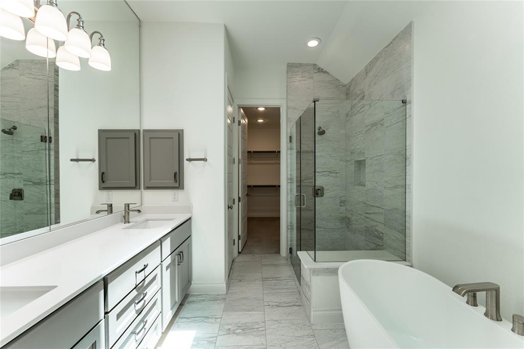 152 Limestone Drive Georgetown, TX 78628 - Photo 25 of 36 a bathroom with a double vanity sink mirror and shower