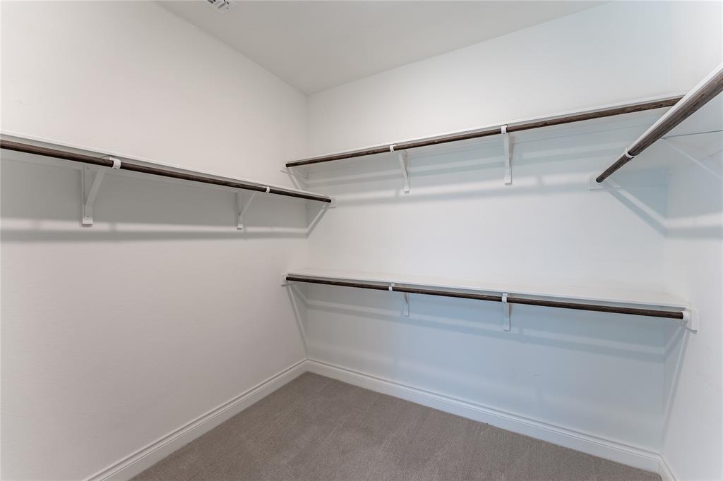 152 Limestone Drive Georgetown, TX 78628 - Photo 27 of 36 a view of a room with racks on the wall