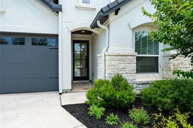 a front view of a house with a garage