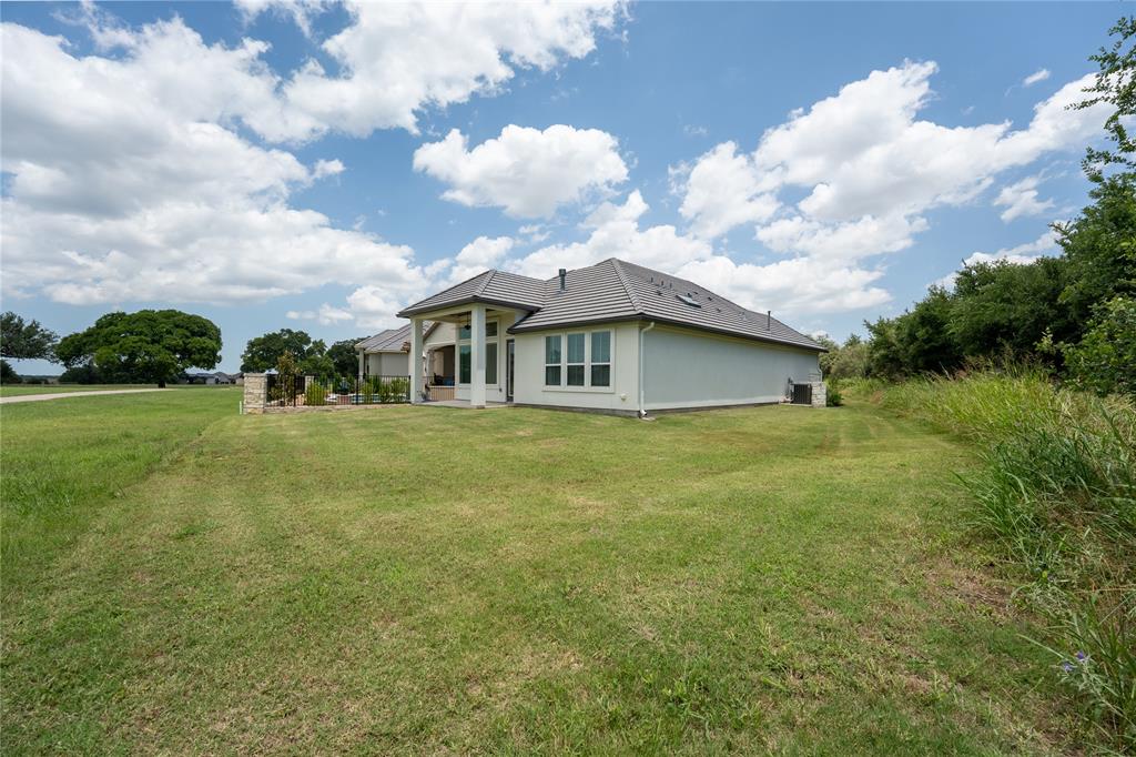 152 Limestone Drive Georgetown, TX 78628 - Photo 32 of 36 a view of a house with a yard