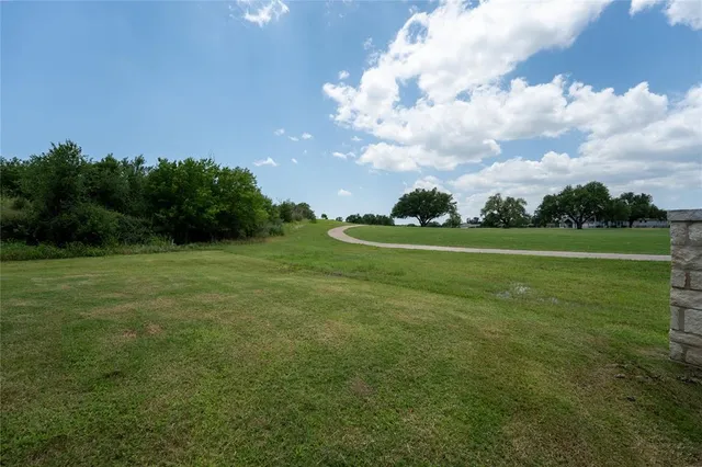a view of a golf course with a garden
