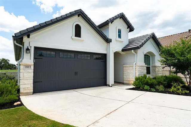 a house view with a outdoor space