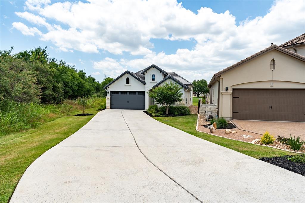 152 Limestone Drive Georgetown, TX 78628 - Photo 5 of 36 a front view of a house with a yard and garage