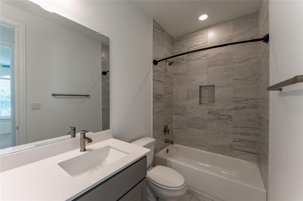 152 Limestone Drive Georgetown, TX 78628 - Photo 9 of 36 a bathroom with a sink toilet and shower