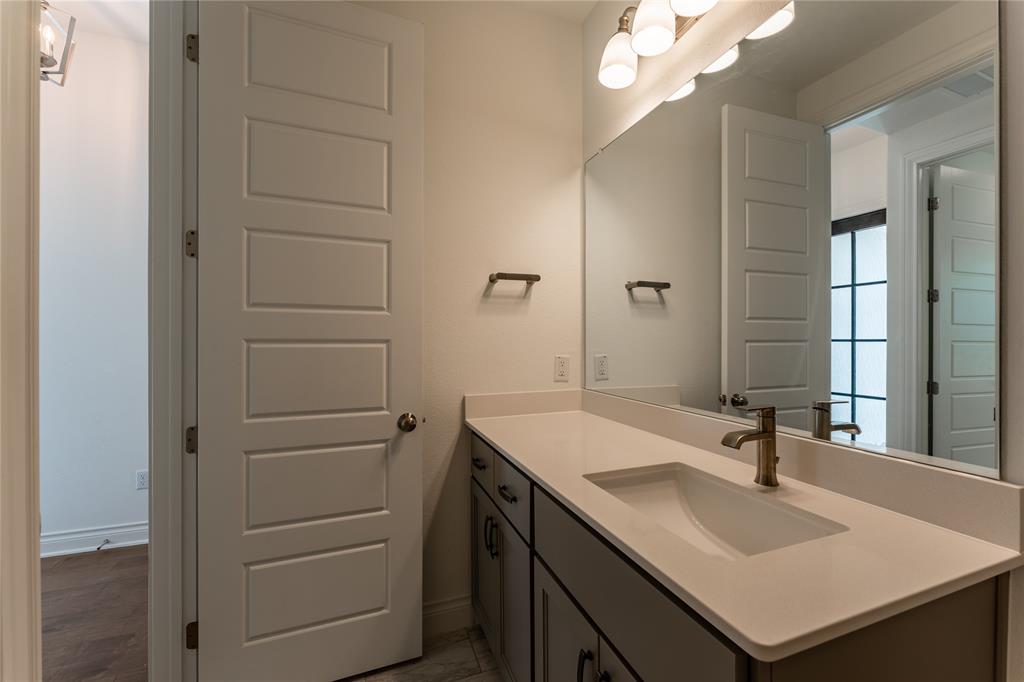 152 Limestone Drive Georgetown, TX 78628 - Photo 10 of 36 a bathroom with a sink and a mirror