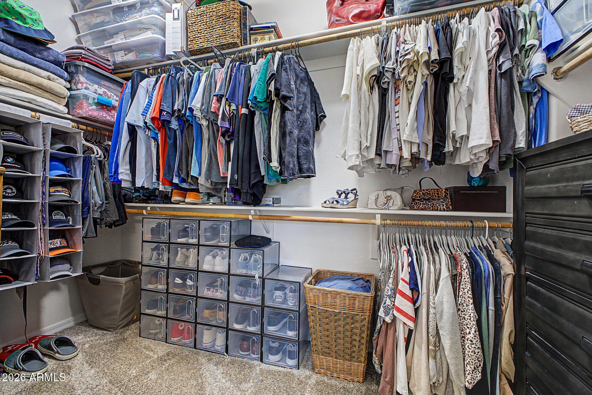 4924 West Harwell Road Laveen, AZ 85339 - Photo 17 of 27 a view of walk in closet with clothes and shoes