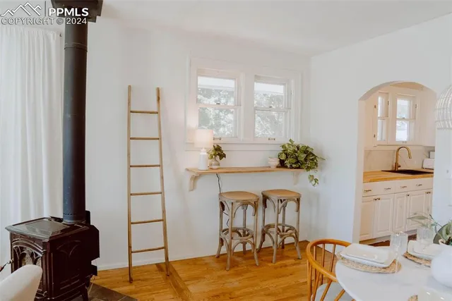 a view of a workspace room with wooden floor