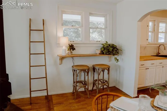 a view of a bedroom with furniture and staircase