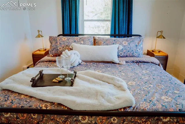 a bedroom with a bed and window