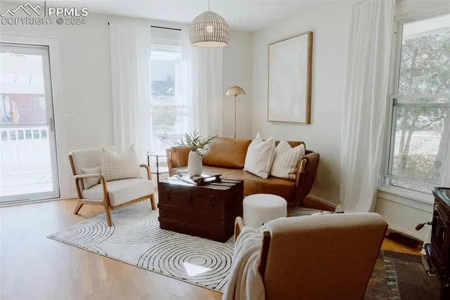 a living room with furniture and a window