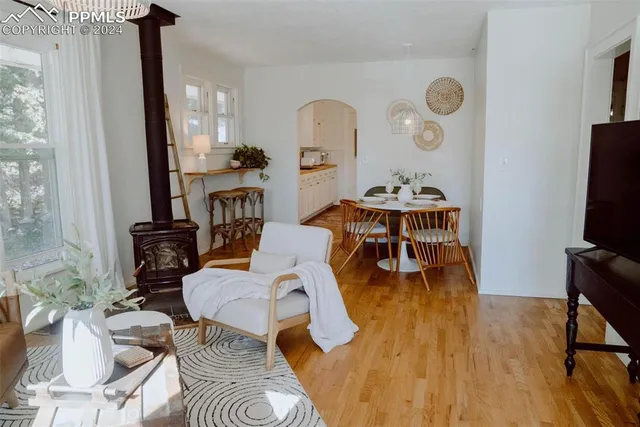 a living room with furniture a flat screen tv and rug floor