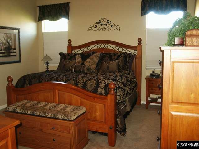 10620 Sterling Ridge Way Reno, NV 89521 - Photo 4 of 6 a bedroom with a bed and a window