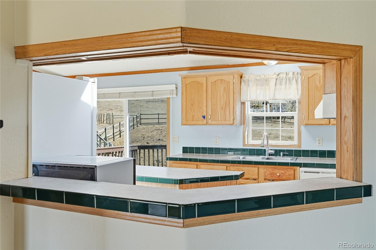 4441 Goldenburg Canyon Road Hartsel, CO 80449 - Photo 13 of 48 a room with a large window and a rug