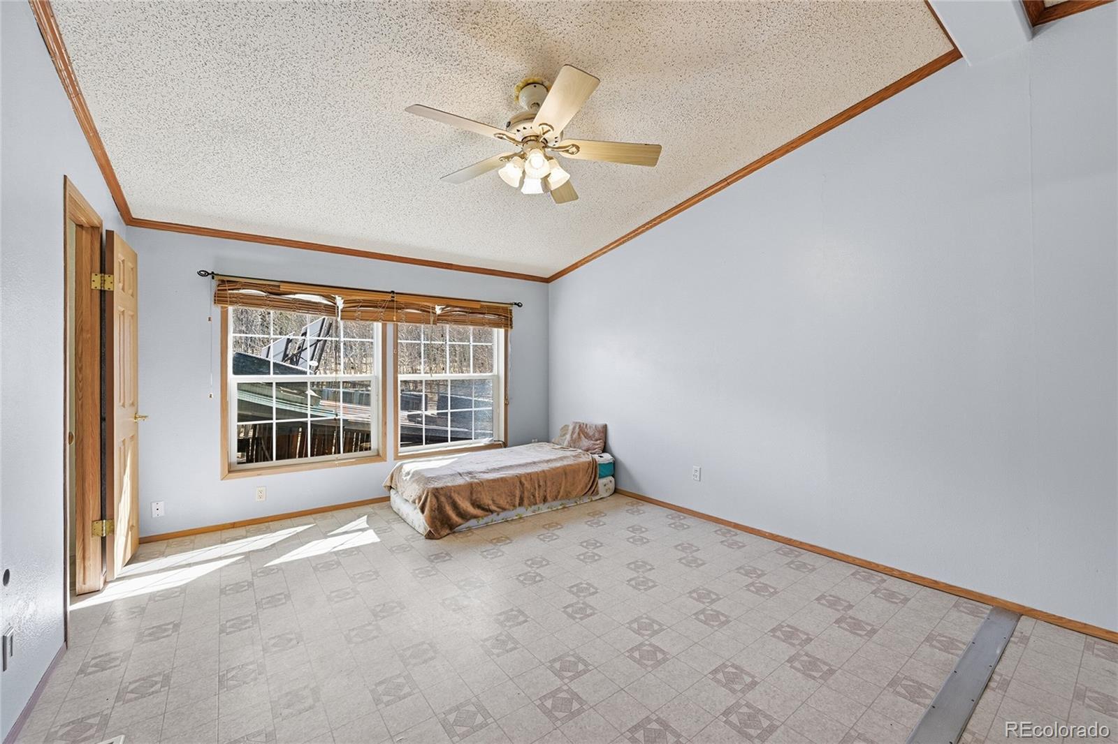 4441 Goldenburg Canyon Road Hartsel, CO 80449 - Photo 19 of 48 a view of an empty room with a window