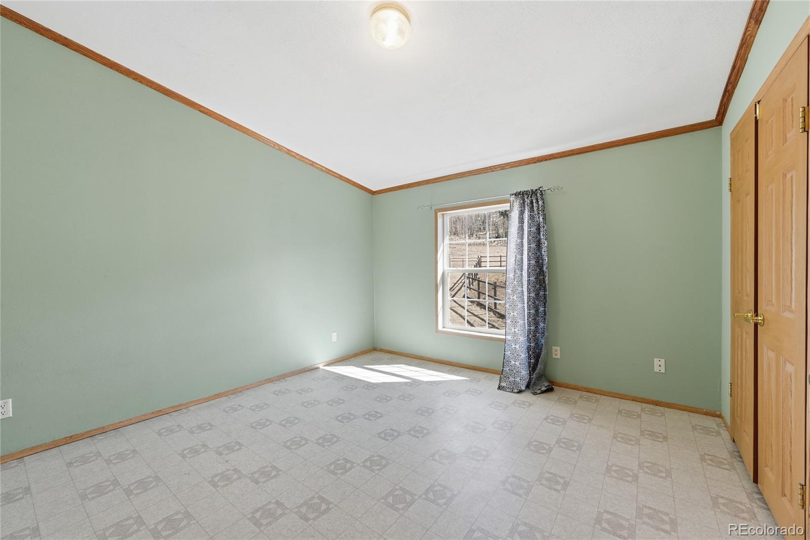 4441 Goldenburg Canyon Road Hartsel, CO 80449 - Photo 28 of 48 a view of an empty room with a window