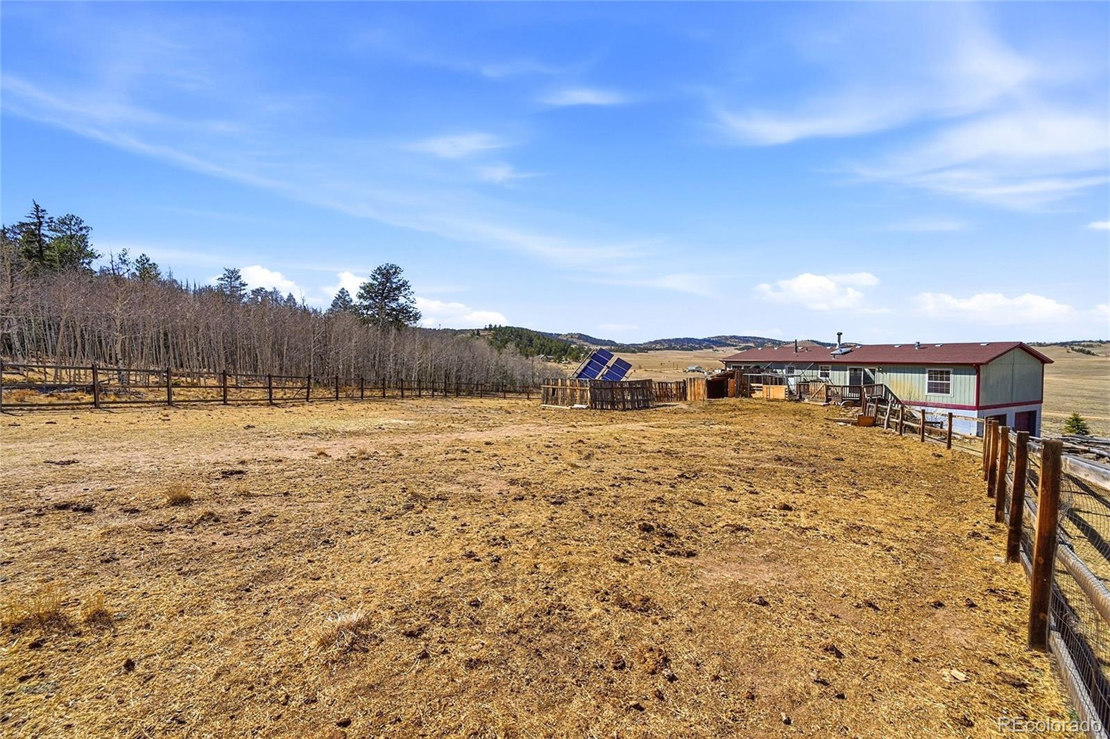 4441 Goldenburg Canyon Road Hartsel, CO 80449 - Photo 38 of 48 a view of a yard with an ocean