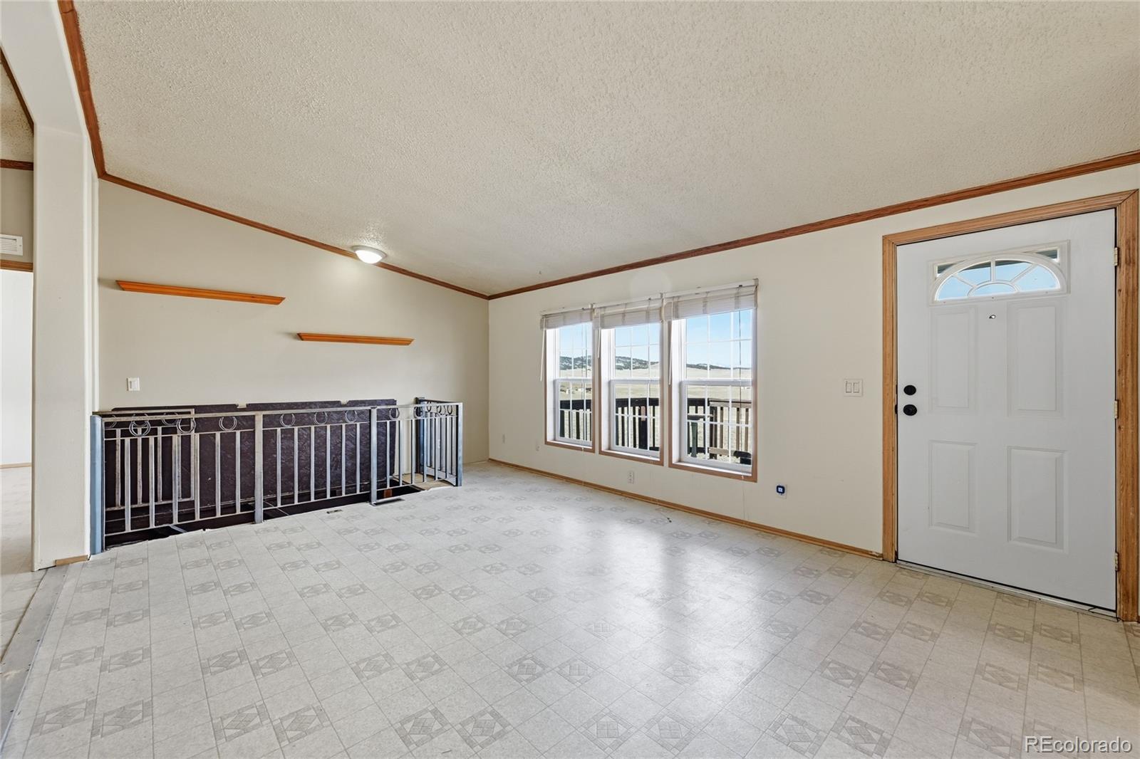 4441 Goldenburg Canyon Road Hartsel, CO 80449 - Photo 9 of 48 a view of an empty room with a window