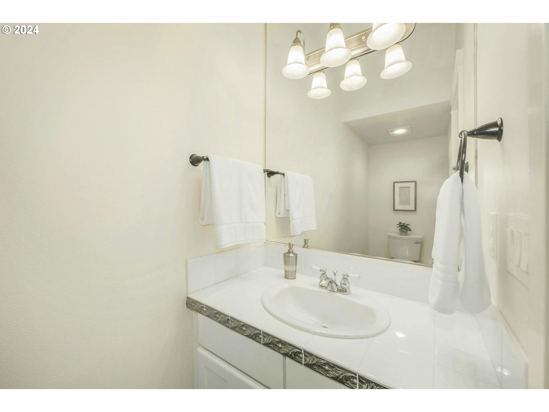 2324 Northwest Miller Road Portland, OR 97229 - Photo 15 of 29 a bathroom with a sink and a mirror