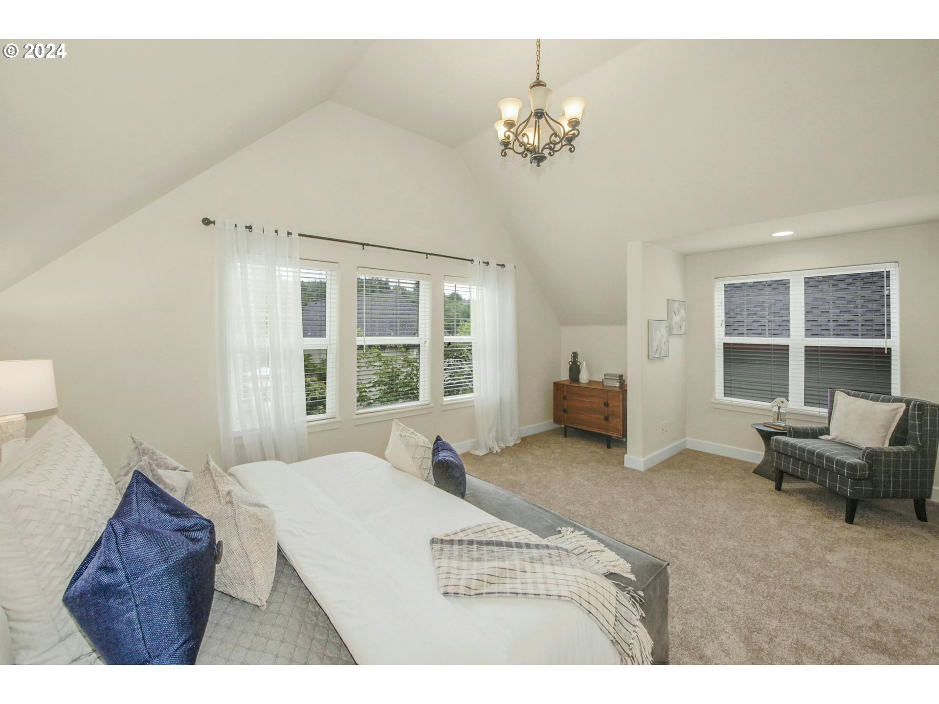 2324 Northwest Miller Road Portland, OR 97229 - Photo 16 of 29 a living room with furniture and a chandelier