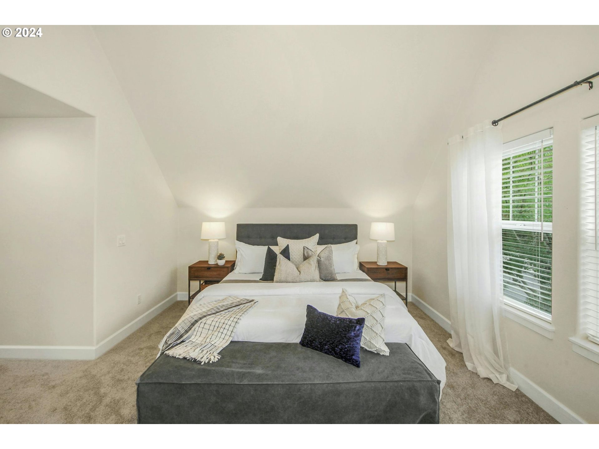 2324 Northwest Miller Road Portland, OR 97229 - Photo 17 of 29 a bedroom with a bed and a window