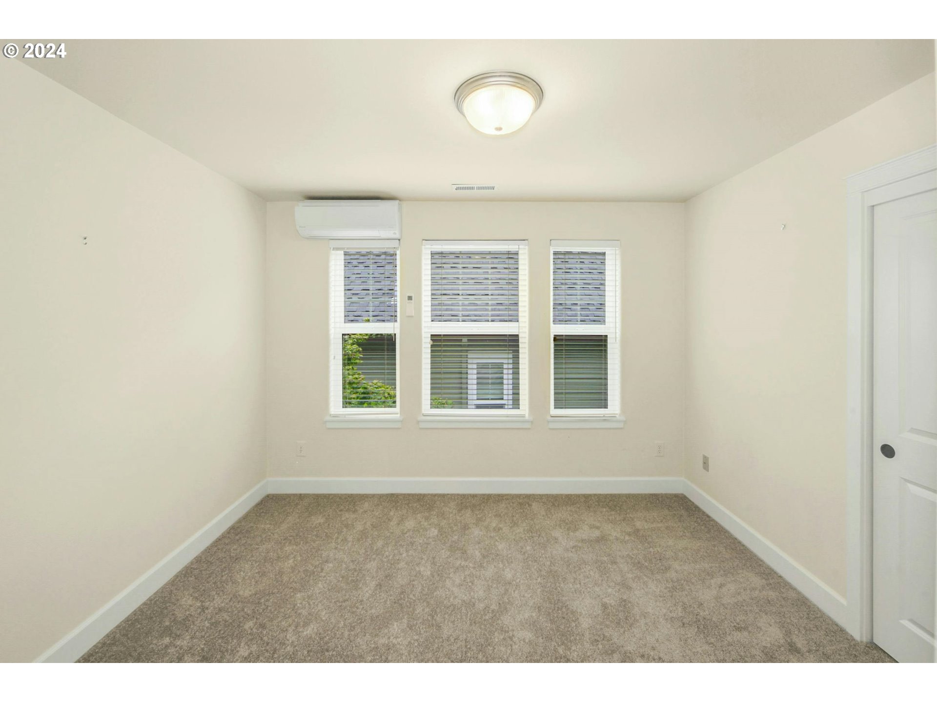2324 Northwest Miller Road Portland, OR 97229 - Photo 21 of 29 an empty room with windows