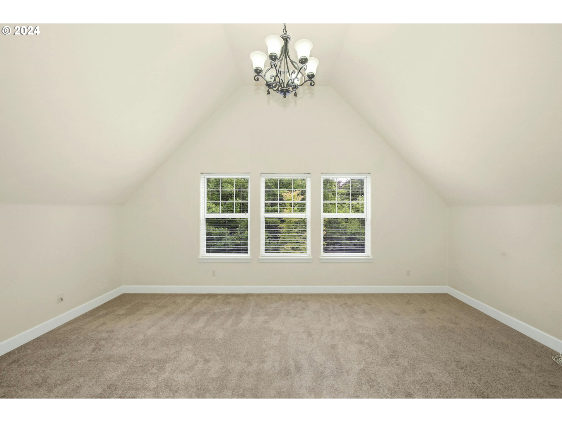 2324 Northwest Miller Road Portland, OR 97229 - Photo 23 of 29 a view of an empty room with a window