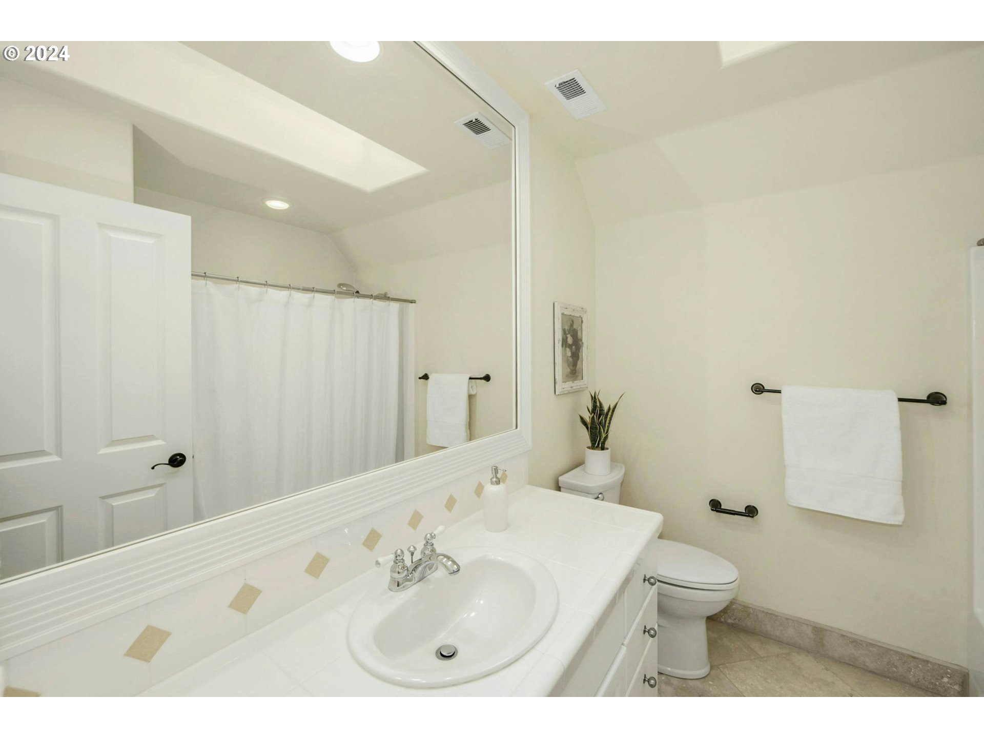 2324 Northwest Miller Road Portland, OR 97229 - Photo 24 of 29 a bathroom with a sink a toilet and shower