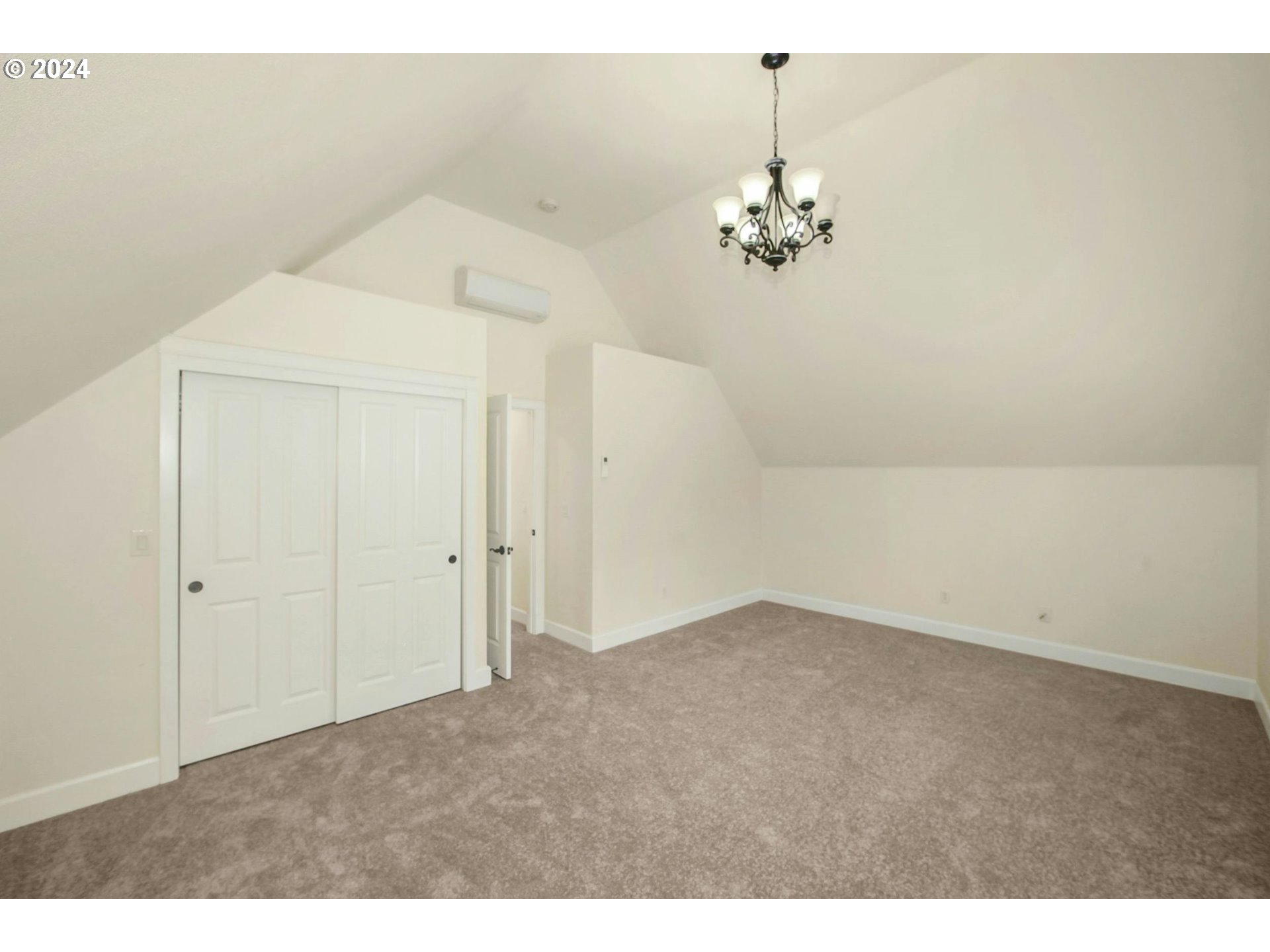 2324 Northwest Miller Road Portland, OR 97229 - Photo 26 of 29 a view of a chandelier fan in an empty room