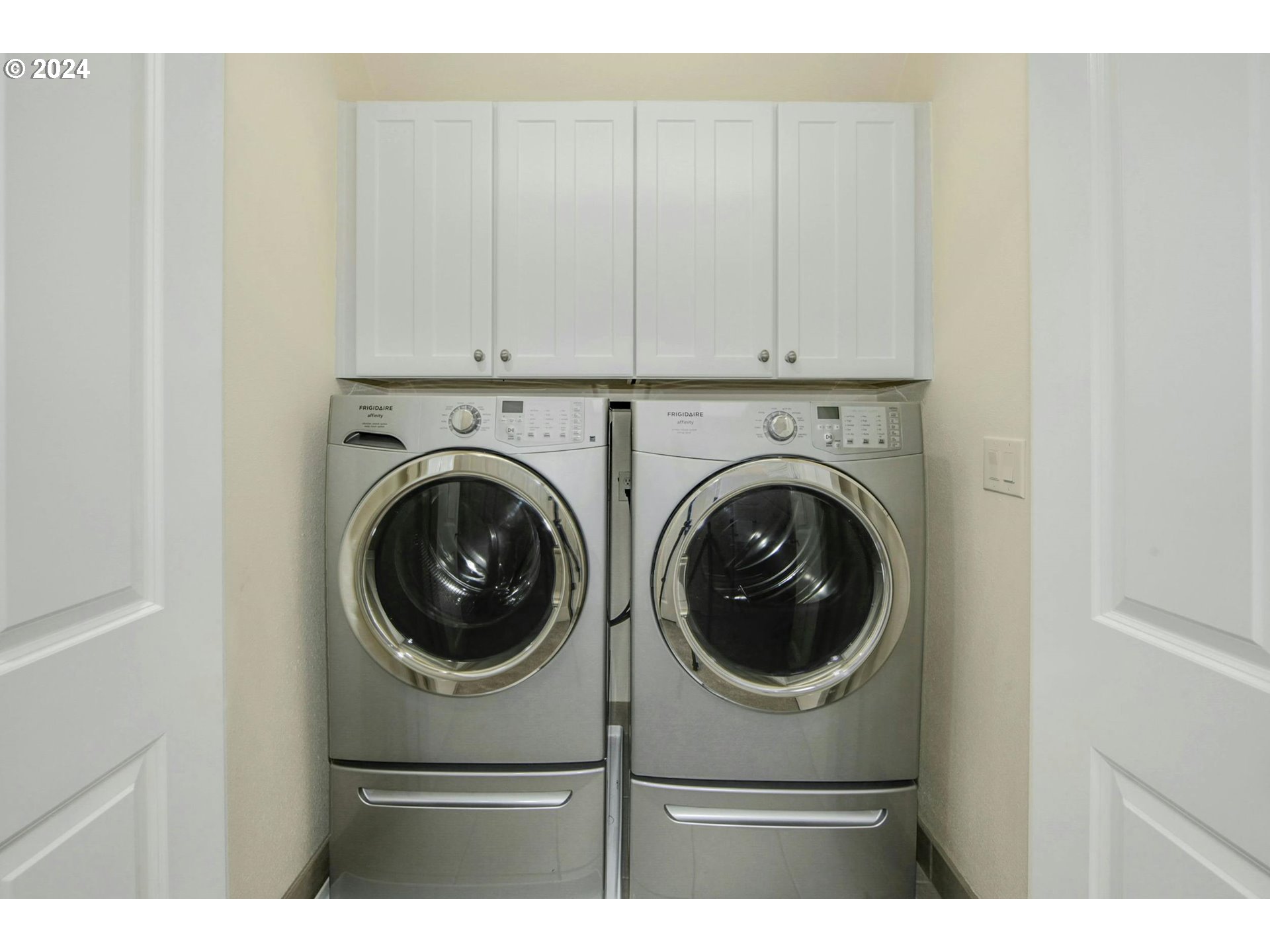 2324 Northwest Miller Road Portland, OR 97229 - Photo 27 of 29 a view of a hallway with washer and dryer