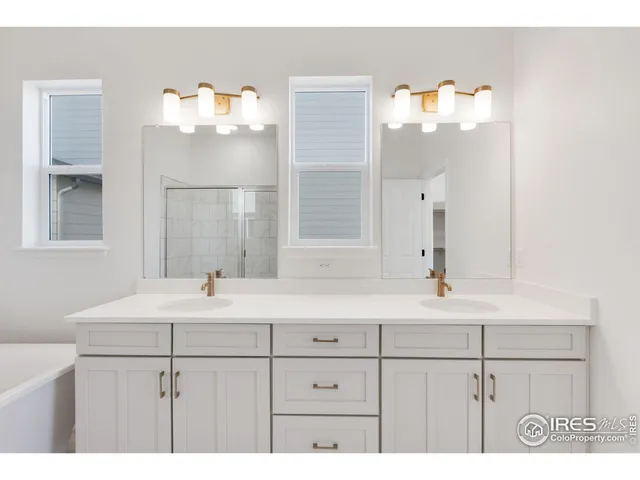 a bathroom with a sink a mirror and a bathtub