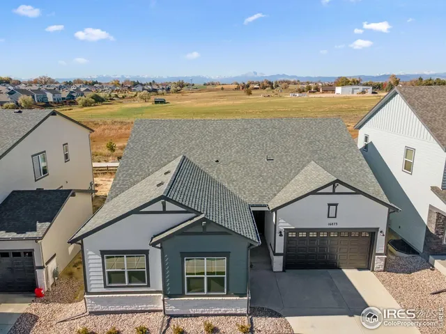 a view of a house with swimming pool and a yard