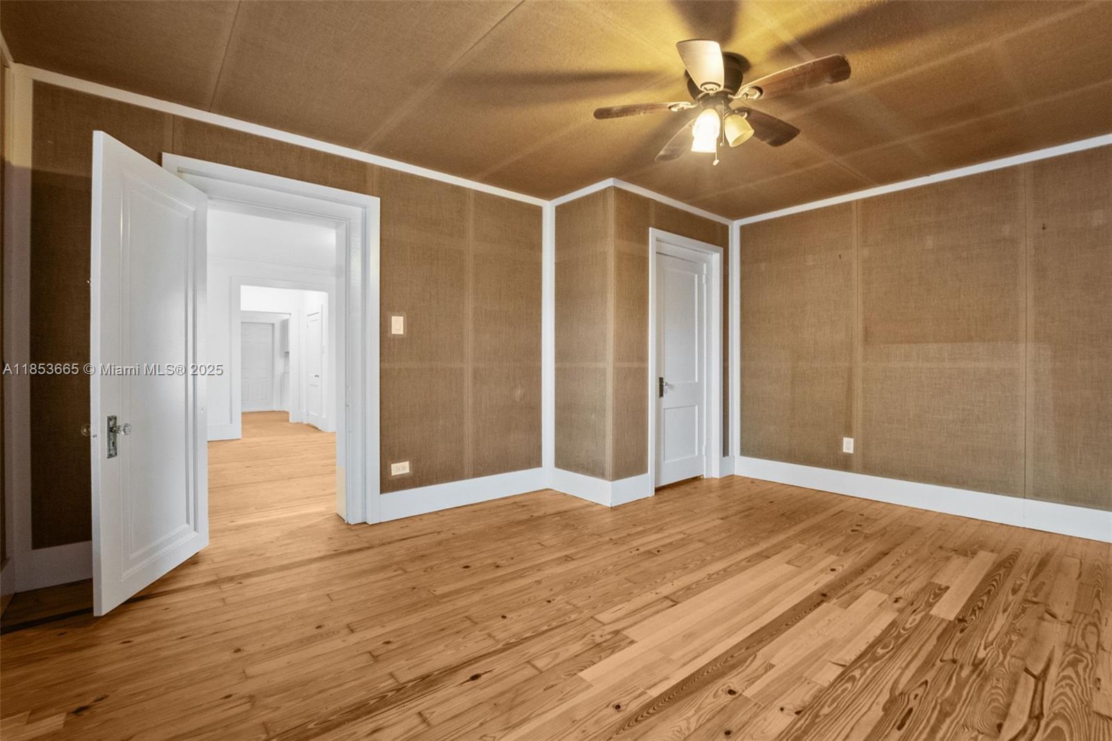 1721 Southwest 21st Terrace, Unit 1719 Miami, FL 33145 - Photo 18 of 25 a view of livingroom with hardwood floor and a ceiling fan