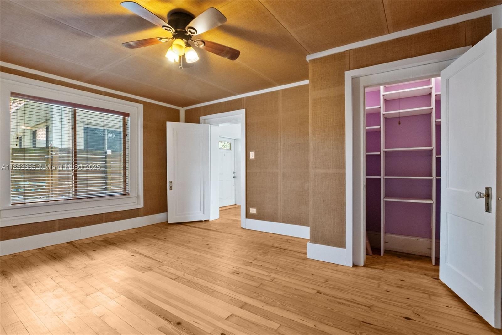 1721 Southwest 21st Terrace, Unit 1719 Miami, FL 33145 - Photo 20 of 25 a view of an empty room with window and wooden floor