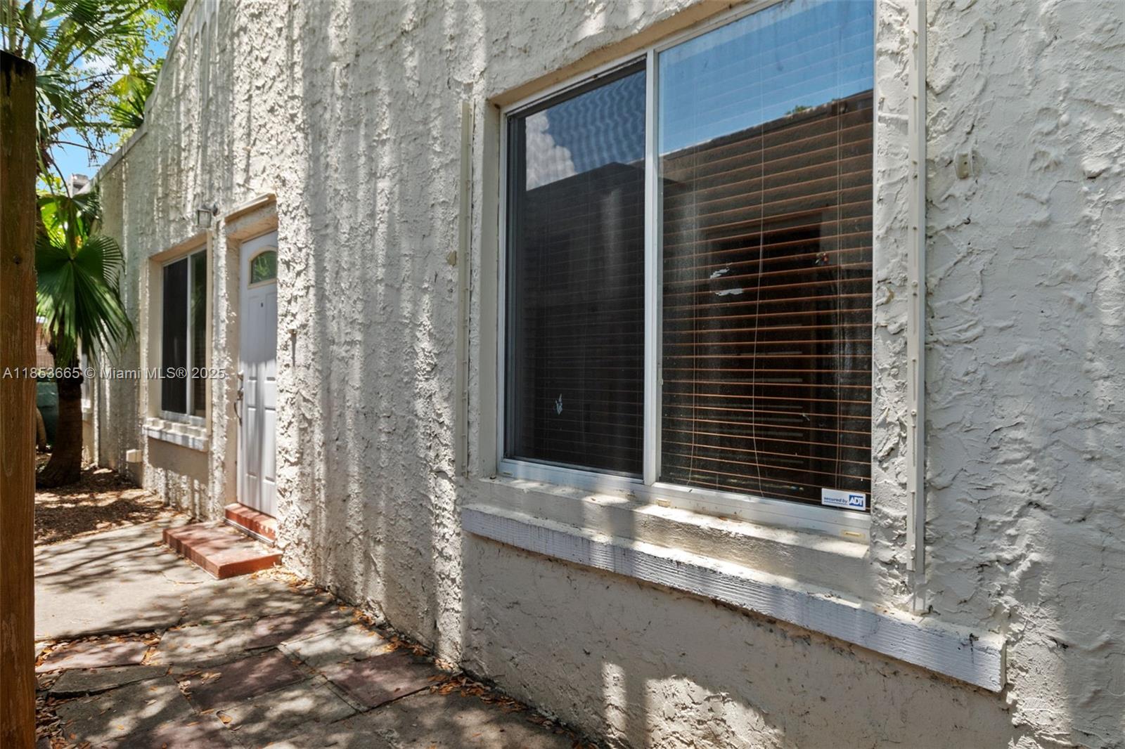 1721 Southwest 21st Terrace, Unit 1719 Miami, FL 33145 - Photo 23 of 25 a view of entrance door of the house