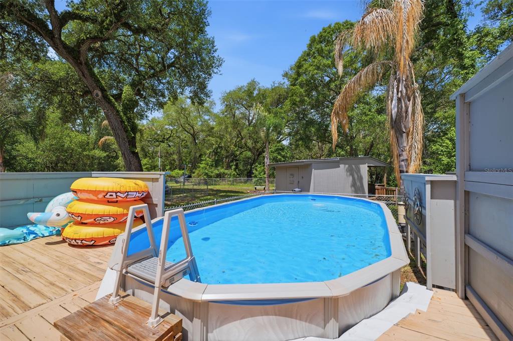 3183 Cedley Road Dade City, FL 33523 - Photo 4 of 48 a view of a swimming pool with a patio
