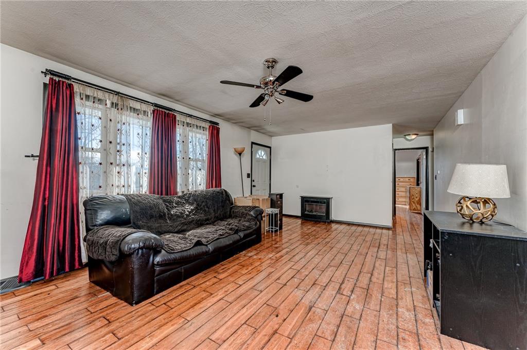 554 Collier Road Uniontown, PA 15401 - Photo 17 of 24 a living room with furniture and a wooden floor