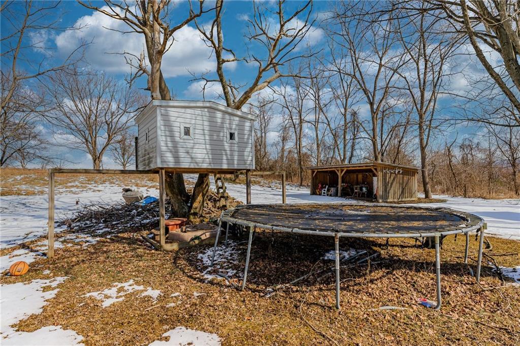 554 Collier Road Uniontown, PA 15401 - Photo 6 of 24 a view of a chairs and table in backyard