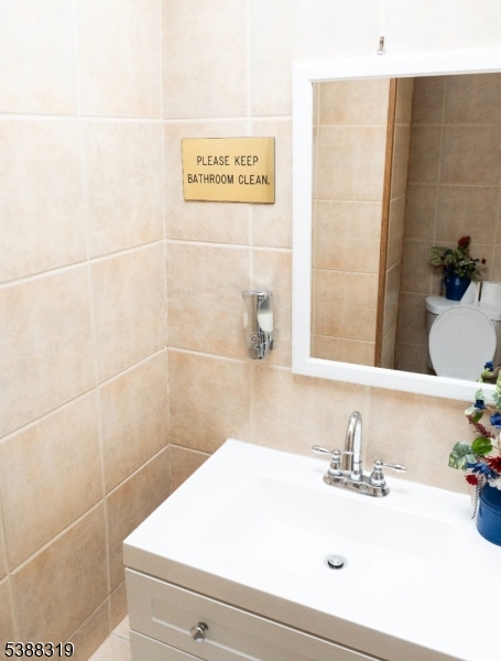 643 Elizabeth Avenue Elizabeth Port, NJ 07206 - Photo 11 of 36 a bathroom with a sink and a mirror