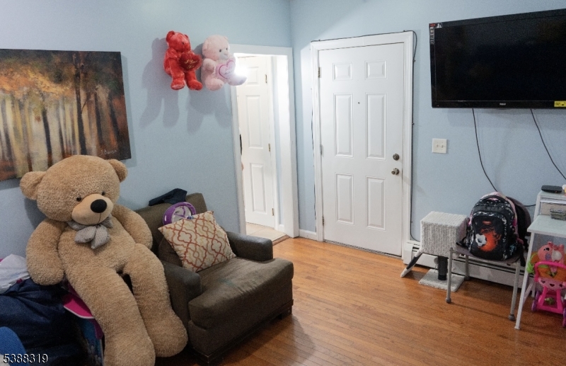 643 Elizabeth Avenue Elizabeth Port, NJ 07206 - Photo 14 of 36 a living room with furniture and a flat screen tv