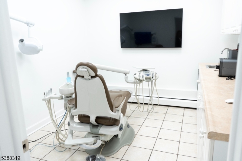 643 Elizabeth Avenue Elizabeth Port, NJ 07206 - Photo 2 of 36 a living room with a flat screen tv and a floor to ceiling window