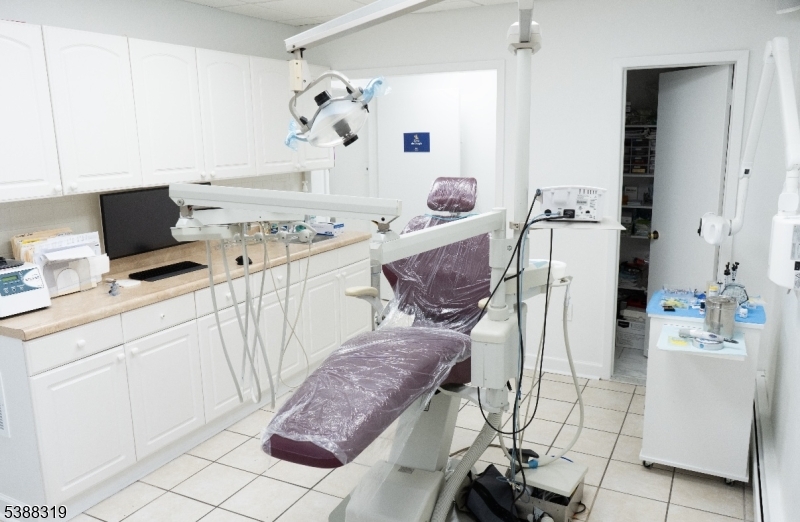 643 Elizabeth Avenue Elizabeth Port, NJ 07206 - Photo 7 of 36 a living room with furniture and a flat screen tv