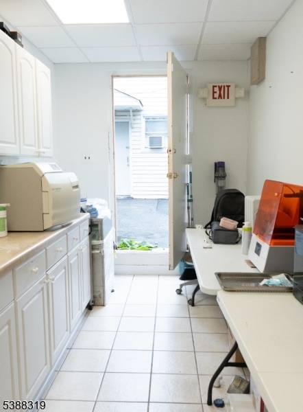 643 Elizabeth Avenue Elizabeth Port, NJ 07206 - Photo 8 of 36 a kitchen with a sink and a stove top oven