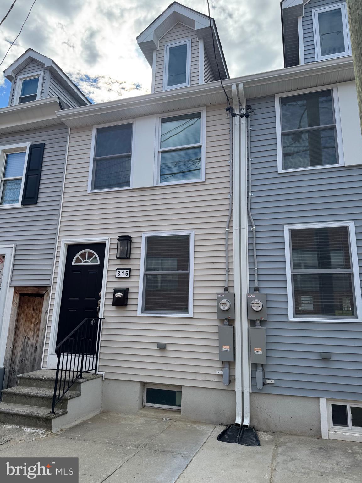316 Ridgeway Street Gloucester City, NJ 08030 - Photo 15 of 15 a view of a house with more windows and brick walls