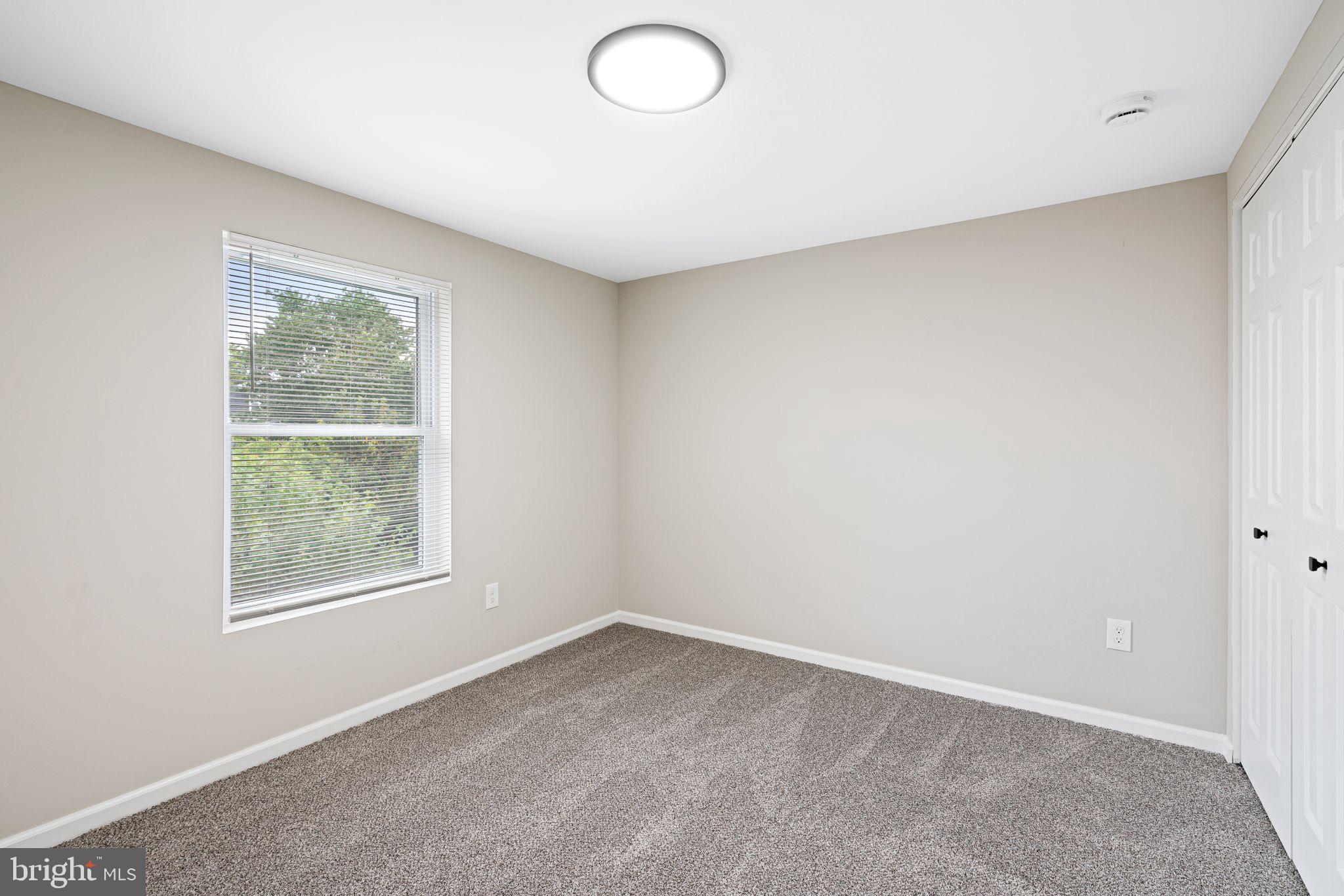 316 Ridgeway Street Gloucester City, NJ 08030 - Photo 8 of 15 an empty room with a window