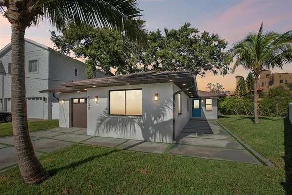 a front view of a house with a yard