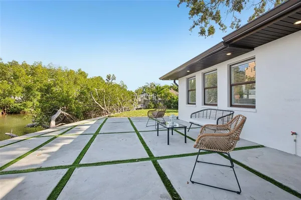 a view of a chairs and table in the patio