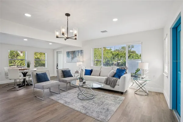 a living room with furniture or window and a wooden floor