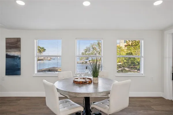 a view of a dining room with furniture and windows