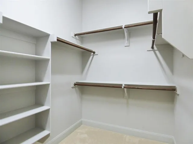a view of an empty walk in closet